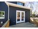 Exterior view of a dark colored house with a back deck and access via french doors at 202 Westerwood Dr, Rock Hill, SC 29732