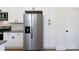 Gourmet kitchen features stainless steel refrigerator and ample storage space at 202 Westerwood Dr, Rock Hill, SC 29732