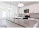 Well-designed kitchen featuring stainless steel appliances, granite countertops and modern light fixtures at 202 Westerwood Dr, Rock Hill, SC 29732