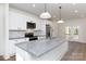 Modern kitchen featuring granite countertops, stainless steel appliances, and a spacious island at 202 Westerwood Dr, Rock Hill, SC 29732