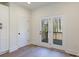 Bright room featuring stylish flooring and door to outdoor deck at 202 Westerwood Dr, Rock Hill, SC 29732