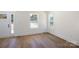 Inviting living room with wood-look floors, large windows, and plenty of natural light throughout at 202 Westerwood Dr, Rock Hill, SC 29732