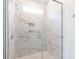 Modern shower with marble-look tiles and a glass door enclosure at 202 Westerwood Dr, Rock Hill, SC 29732