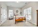 Comfortable bedroom featuring a double bed, ceiling fan, good natural light, and ample closet space at 2023 Aragon Ln, Gastonia, NC 28056
