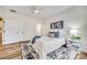 Bright bedroom featuring hard wood floors, a comfortable bed and a large closet for optimal storage at 2023 Aragon Ln, Gastonia, NC 28056
