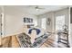Bright bedroom with a ceiling fan, ample natural light, stylish decor, and wood-look flooring at 2023 Aragon Ln, Gastonia, NC 28056