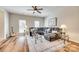 Spacious living room with hardwood flooring, a plush sectional, and an area rug at 2023 Aragon Ln, Gastonia, NC 28056