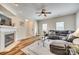 Comfortable living space featuring a fireplace, wood floors, and a large sofa at 2023 Aragon Ln, Gastonia, NC 28056