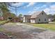 The home's exterior shows a garage and large back yard with plenty of parking at 203 Jackson St, Fort Mill, SC 29715