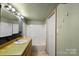 A compact bathroom with a shower, sink, toilet and vanity with a mirror at 203 Jackson St, Fort Mill, SC 29715