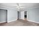 Bedroom featuring neutral walls, carpet floor, closets, and a window at 203 Jackson St, Fort Mill, SC 29715