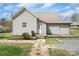 Charming one-story home with tidy landscaping, gray siding, and an inviting front entrance at 203 Jackson St, Fort Mill, SC 29715