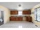 The kitchen features wood cabinets, tile floor, and a window at 203 Jackson St, Fort Mill, SC 29715