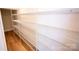 Large walk-in closet with extensive wire shelving and wood-look flooring at 219 Halemarg Dr, Belmont, NC 28012