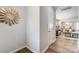 Bright entryway with wood floors, a stylish mirror, and an open view into the living area at 2365 Hedgecliff Rd, Kannapolis, NC 28025