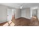 Spacious bedroom with hardwood floors, ceiling fan, and closet at 238 Lippard Springs Cir, Statesville, NC 28677