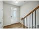 Inviting foyer with hardwood floors, staircase, and door with glass insert, providing a welcoming entrance at 2385 Hedgecliff Rd, Kannapolis, NC 28025