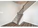 Carpeted staircase with dark wood railing and spindles at 2395 Hedgecliff Rd, Kannapolis, NC 28025