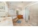 Bathroom features a soaking tub, glass shower, and dual sink vanity at 306 Nance Rd, Charlotte, NC 28214