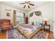 Bedroom featuring hardwood floors, a ceiling fan, and ample natural light at 306 Nance Rd, Charlotte, NC 28214