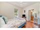 Cozy bedroom with hardwood floors, ceiling fan, and ensuite bathroom access at 306 Nance Rd, Charlotte, NC 28214