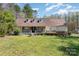 Charming home featuring a welcoming front porch, well-kept lawn, and traditional architectural details at 306 Nance Rd, Charlotte, NC 28214