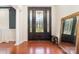 Grand foyer with a decorative front door, hardwood floors, and elegant details at 306 Nance Rd, Charlotte, NC 28214
