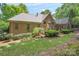 Expansive backyard features a well-manicured lawn, mature landscaping, and a patio area at 310 Berkeley Rd, Rock Hill, SC 29732