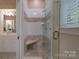 Bright shower featuring tile walls, a glass door, and a built-in bench at 310 Berkeley Rd, Rock Hill, SC 29732