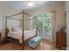 Bedroom showcasing a canopy bed, hardwood floors, and natural light at 310 Berkeley Rd, Rock Hill, SC 29732