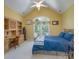 Comfortable bedroom features vaulted ceiling, desk area, and large window overlooking backyard at 310 Berkeley Rd, Rock Hill, SC 29732