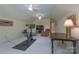 Bonus room features neutral carpet, a ceiling fan, TV, and seating area for relaxing and recreation at 310 Berkeley Rd, Rock Hill, SC 29732