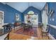 Formal dining area featuring textured blue walls, hardwood floors, and natural light at 310 Berkeley Rd, Rock Hill, SC 29732