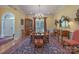 Elegant dining room with hardwood floors, chandelier, and ample space for entertaining guests at 310 Berkeley Rd, Rock Hill, SC 29732