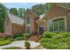 Brick home features a stone walkway leading to a front door with decorative windows and mature landscaping at 310 Berkeley Rd, Rock Hill, SC 29732