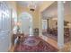 Bright foyer with hardwood floors, chandelier, and arched doorway leading to the dining room at 310 Berkeley Rd, Rock Hill, SC 29732