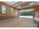 Large garage with wood paneled walls, epoxy flooring, open door and natural light at 310 Berkeley Rd, Rock Hill, SC 29732