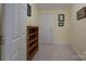 Hallway with neutral carpet, doors, book shelves, paint and trim details at 310 Berkeley Rd, Rock Hill, SC 29732