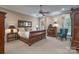 Bright main bedroom featuring a ceiling fan, natural light, and carpeted flooring at 310 Berkeley Rd, Rock Hill, SC 29732