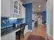 Hallway desk space with granite countertop, white cabinets, and hardwood floors at 310 Berkeley Rd, Rock Hill, SC 29732