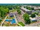 Aerial view of the neighborhood amenities, a playground, green space, and a parking garage at 311 W Center Ave, Mooresville, NC 28115