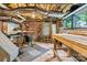View of the basement featuring exposed brick and mechanicals at 311 W Center Ave, Mooresville, NC 28115