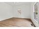 Well lit bedroom with hardwood floors and neutral paint at 311 W Center Ave, Mooresville, NC 28115