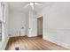 A bright bedroom features wood-look flooring and white trim at 311 W Center Ave, Mooresville, NC 28115