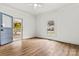 Bright bedroom with hardwood floors and a door that leads to the outdoor porch at 311 W Center Ave, Mooresville, NC 28115