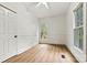 An empty bedroom with two windows, wood-look floors, and a ceiling fan at 311 W Center Ave, Mooresville, NC 28115