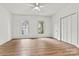 A bright bedroom features beautiful wood-look flooring and closet for ample storage space at 311 W Center Ave, Mooresville, NC 28115