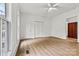 A clean bedroom boasts ample natural light, wood-look flooring, and ample closet space at 311 W Center Ave, Mooresville, NC 28115