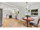 Sunlit breakfast area with decorative lighting and stainless steel appliances at 311 W Center Ave, Mooresville, NC 28115