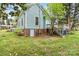 Exterior view of a house featuring a grassy yard at 311 W Center Ave, Mooresville, NC 28115